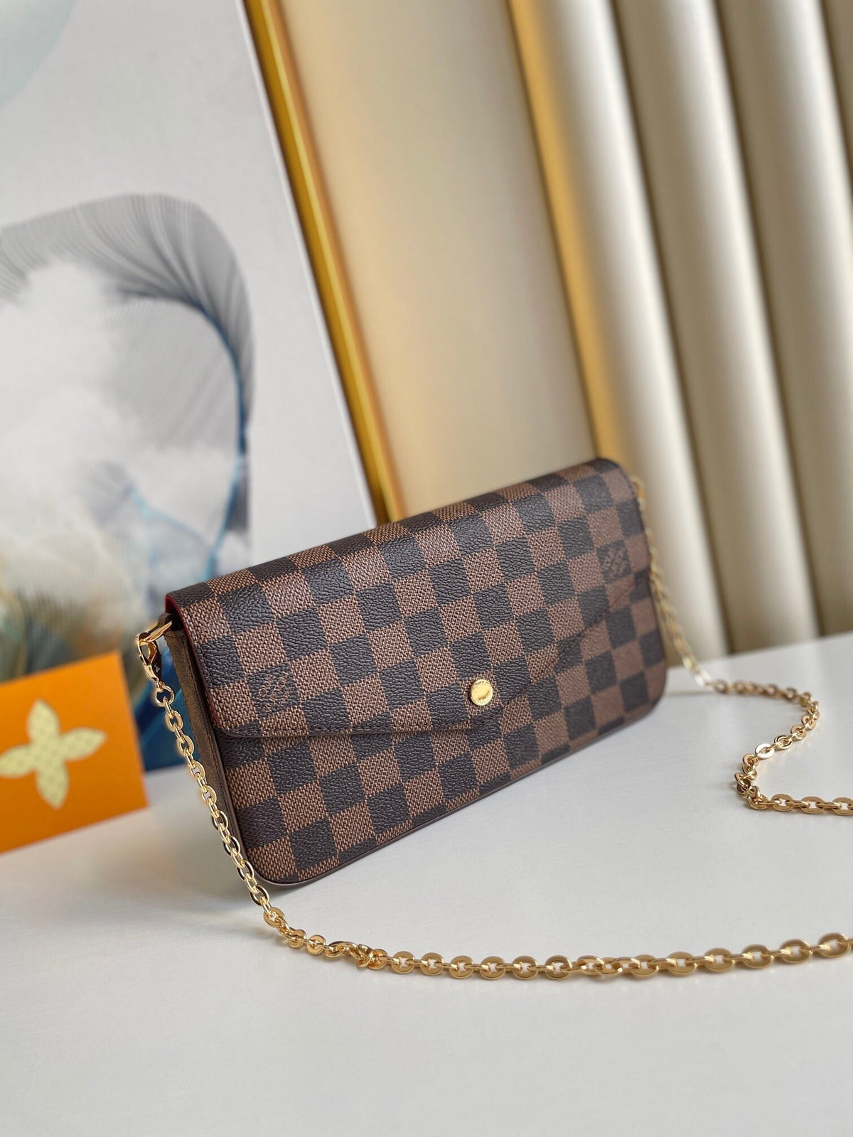 LOUIS VUITTON FÉLICIE POCHETTE 21 IN BROWN DAMIER EBENE COATED CANVAS GOLD HARDWARE