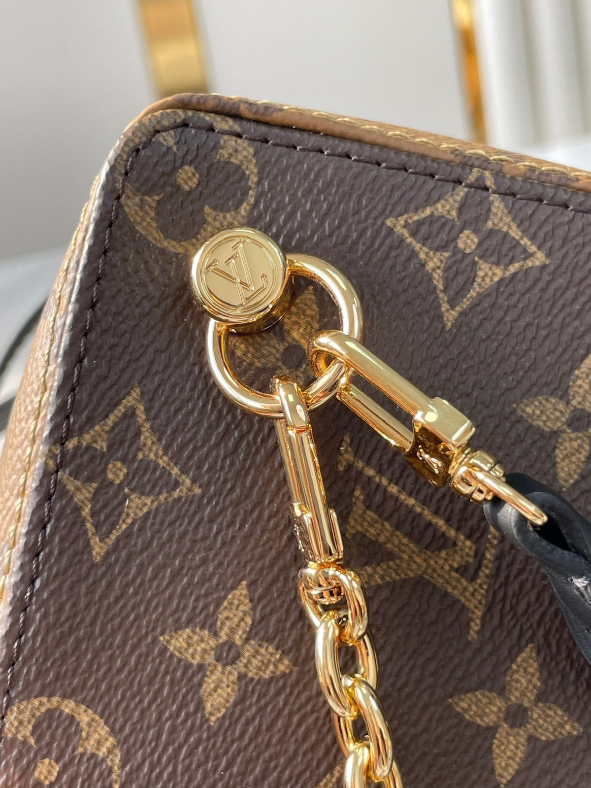 LOUIS VUITTON DICE 9 IN BROWN MONOGRAM AND MONOGRAM REVERSE CANVAS GOLD HARDWARE